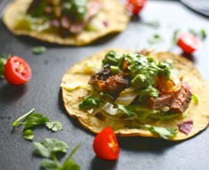 grilled steak taco with herb sauce