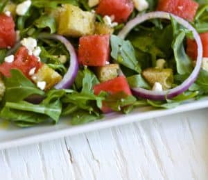 Watermelon Panzanella Salad is the perfect refreshing summer recipe. Crisp arugula combined with juicy watermelon and toasted bread for the ultimate salad.