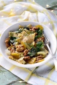 bowl of ravioli with a orange walnut fennel sauce