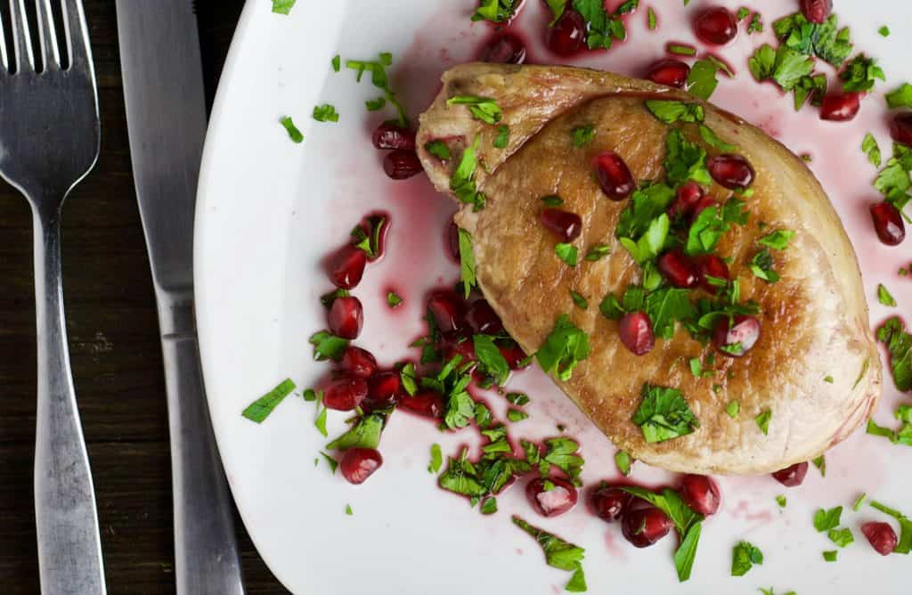 grilled pork chops with pomegranate sauce and cilantro