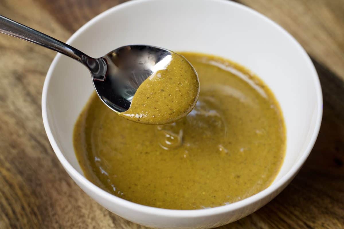 bowl of pistachio paste on a spoon