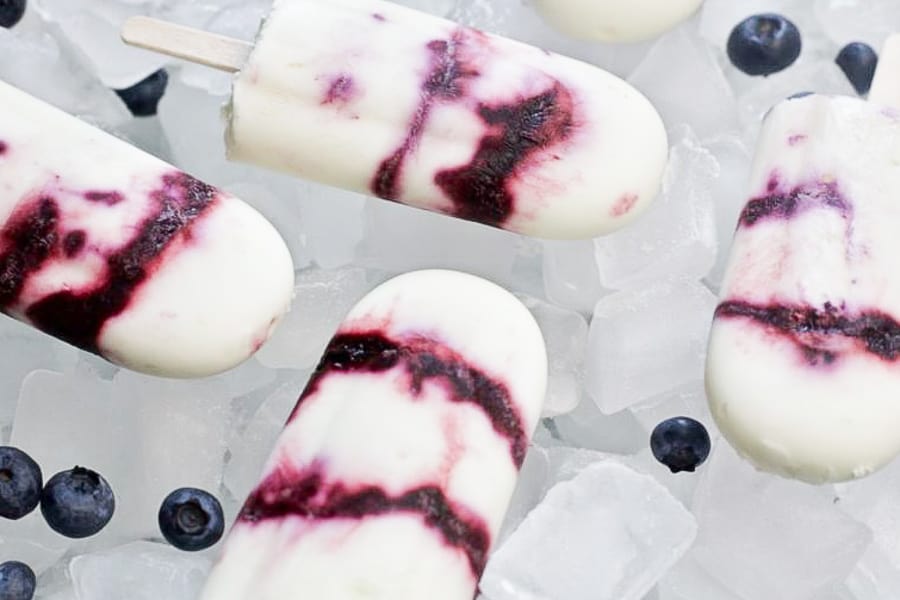 blueberry yogurt popsicles on bed of ice