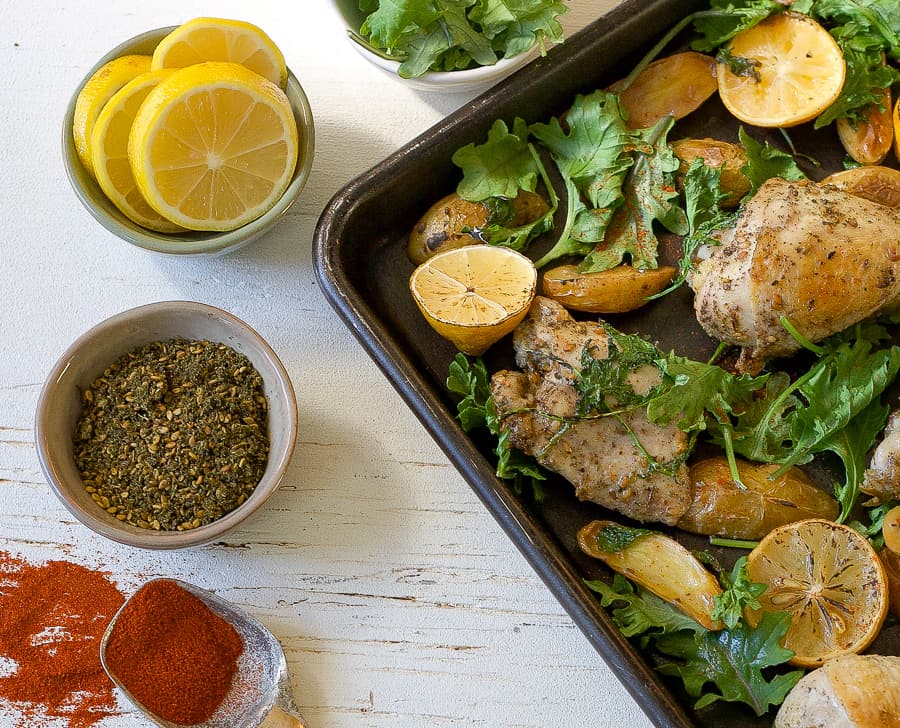 sheet pan chicken za'atar with lemon, spices and paprika