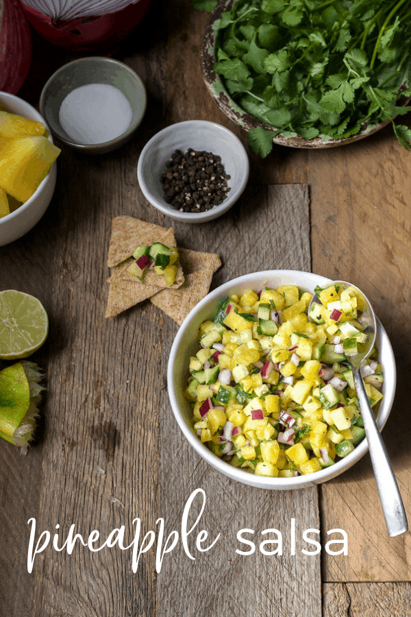 pineapple salsa recipe with cucumber, pineapple, cilantro, lime juice and red onion. Just 4 ingredients and perfect topping for baked chicken or grilled fish. 