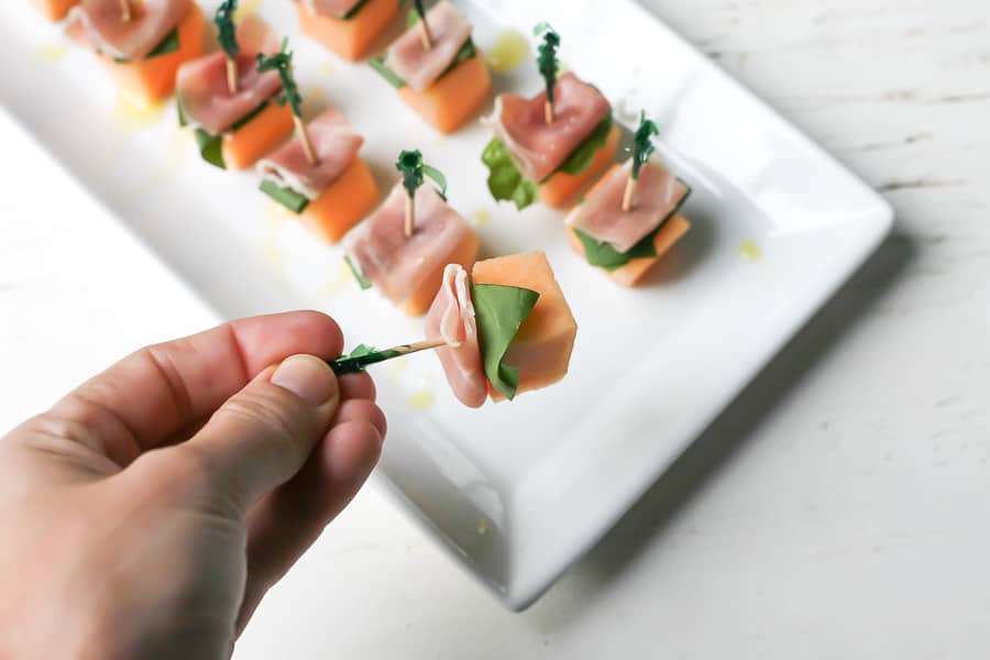 close up up prosciutto and basil cantaloupe bites