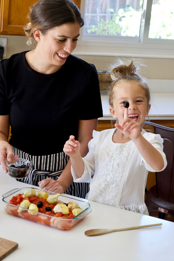 mom and daughter in kitchen learning to cook mediterranean diet inspired recipes