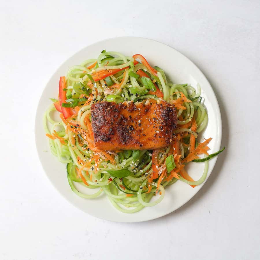 grilled cedar plank salmon on top of veggies