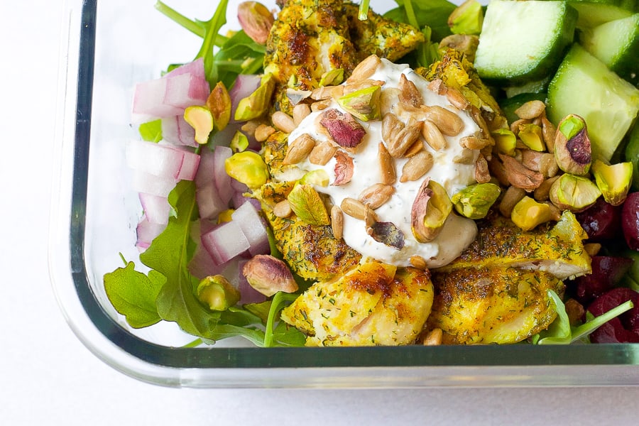 greek chicken bowl with pistachio and sunflower seeds