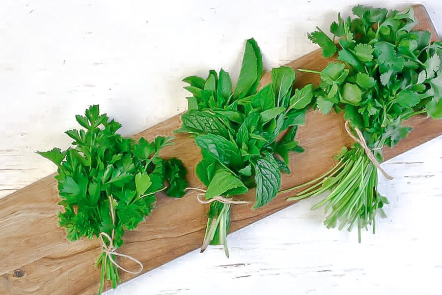 three bundles of fresh herbs as part of my favorite fresh herbs in the mediterranean diet