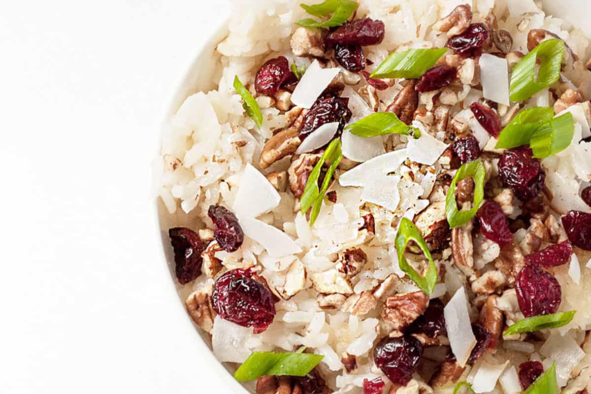 coconut crispy rice bowl with pecans cranberries and scallions