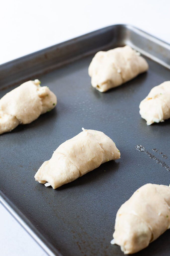 cheesy chicken broccoli rolls on pan