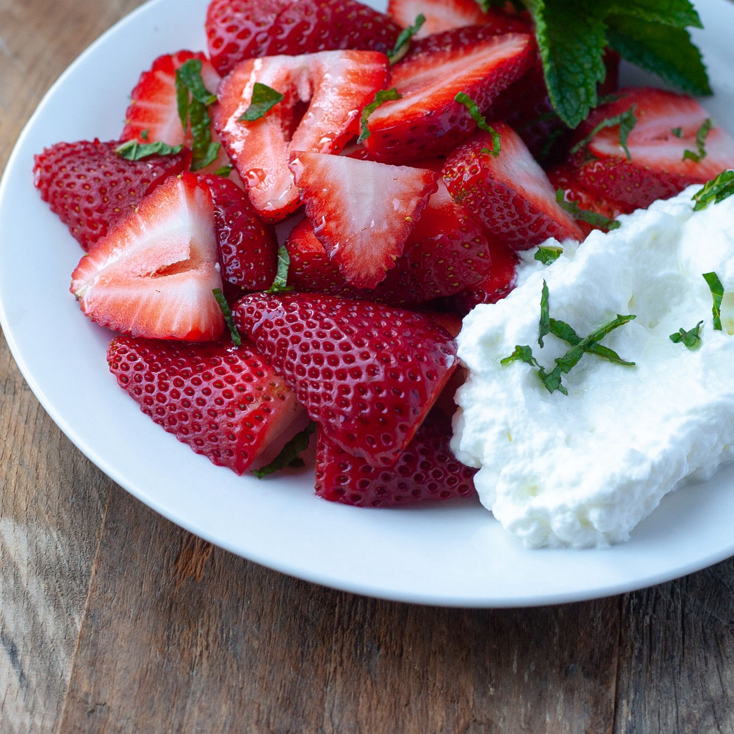 strawberries with olive oil whipped cream and mint