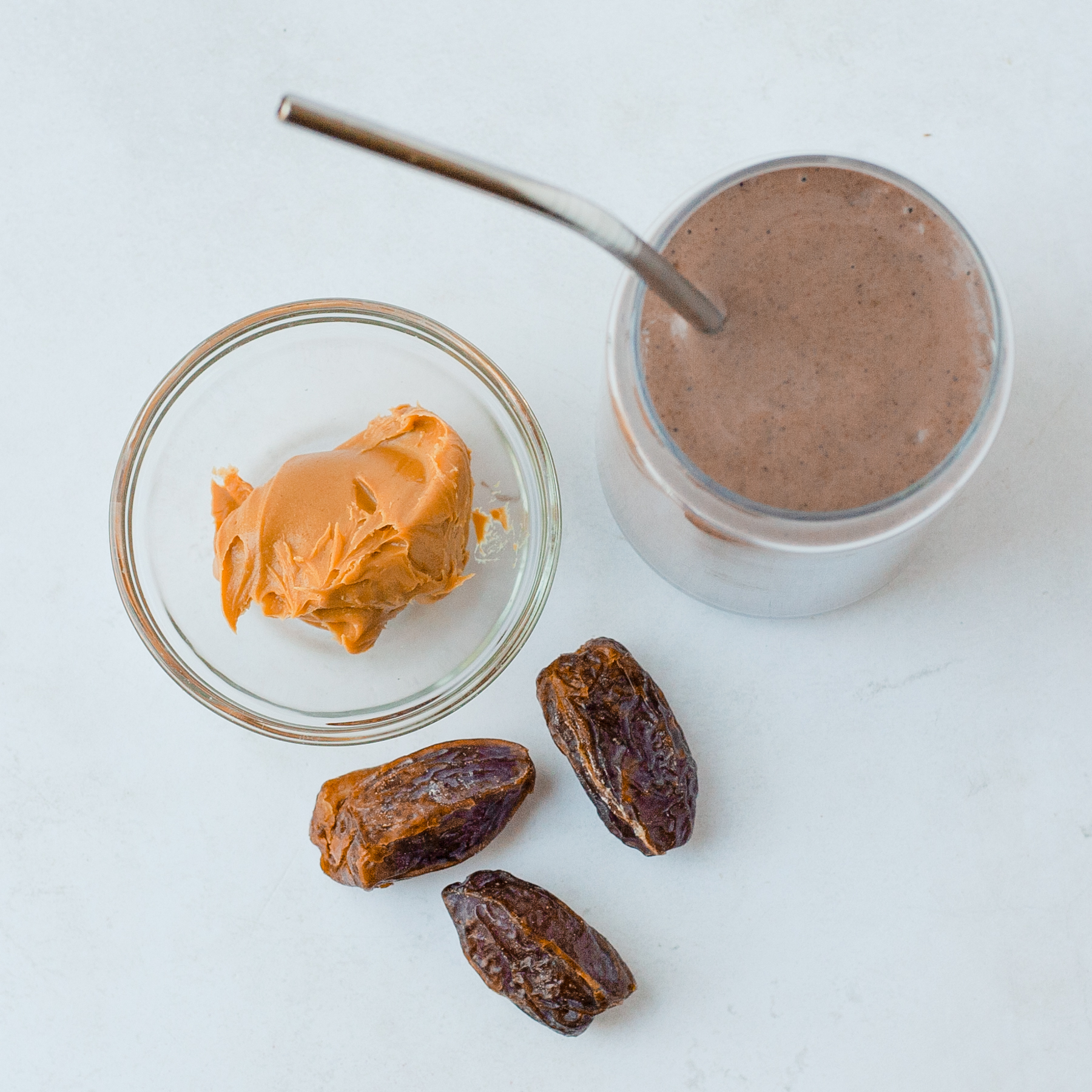 adding dates to peanut butter smoothie