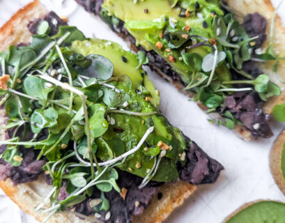 avocado toast with black beans and micro greens