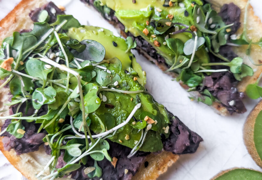 avocado toast with black beans and micro greens